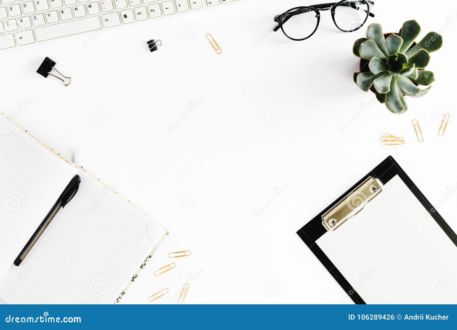 home office desk. women workspace clipboard, notebook, keyboard, glasses