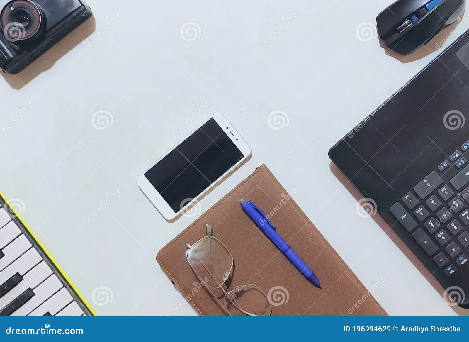 Flat Lay of Office Equipments Including Laptop, Mobile Phone, Diary and