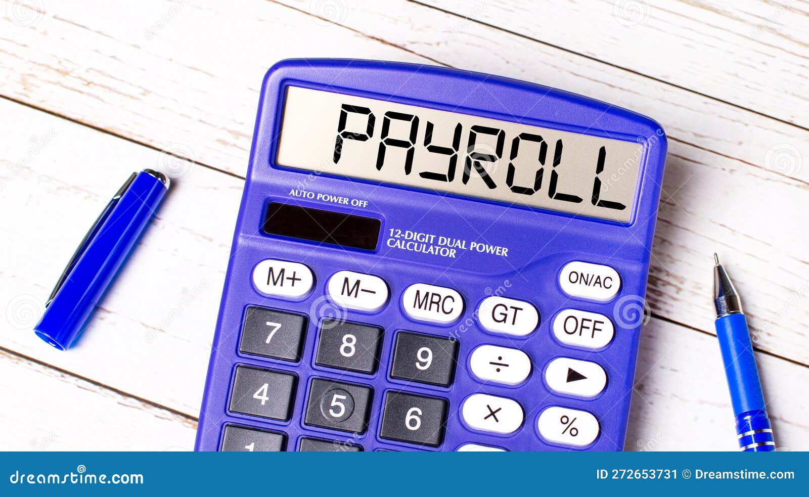 Flat Lay or Top View of Blue Pen and Calculator with PAYROLL Text on
