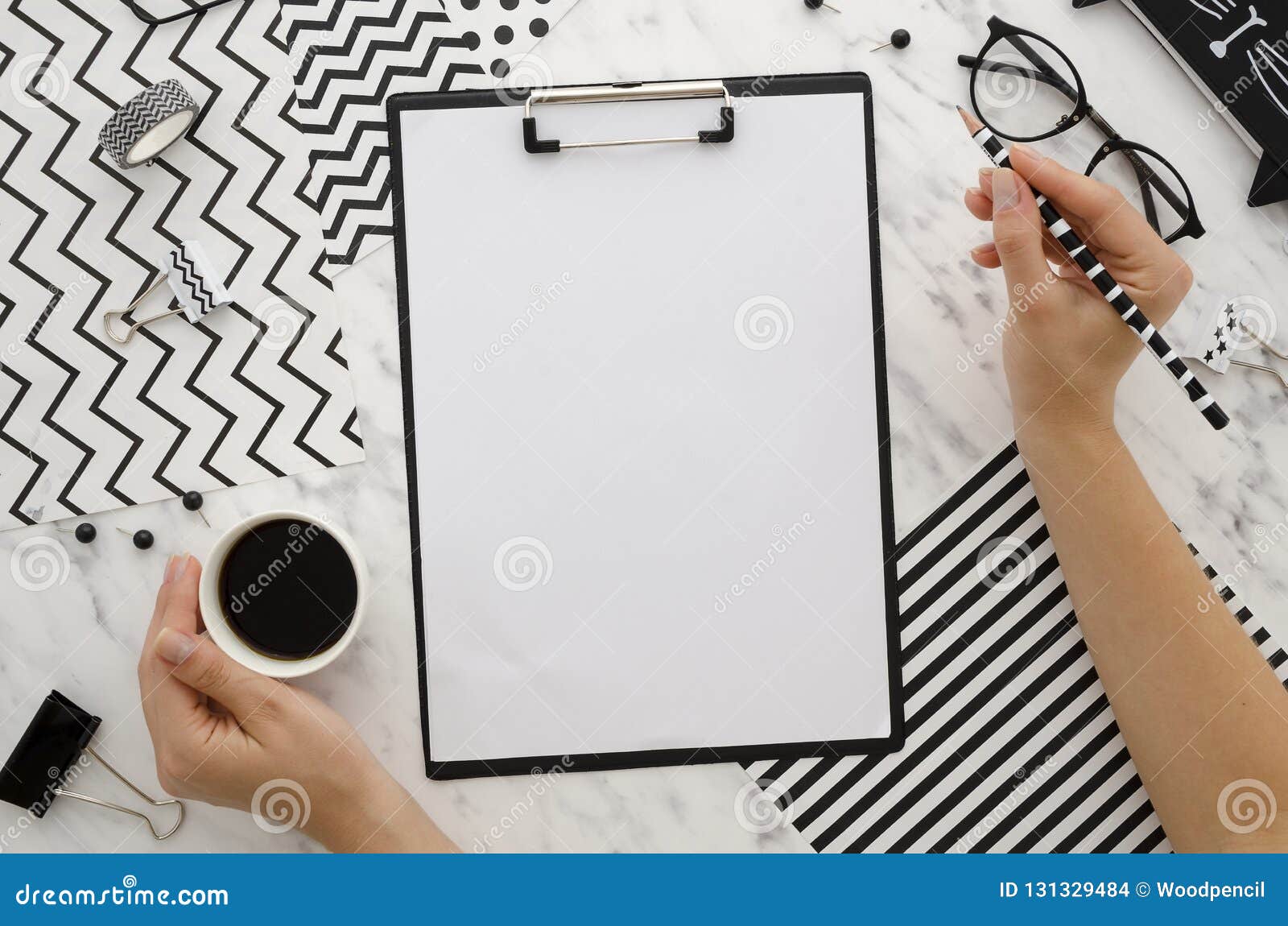 Woman Hands Hold Pencil And Coffee Zebra Background With Blank