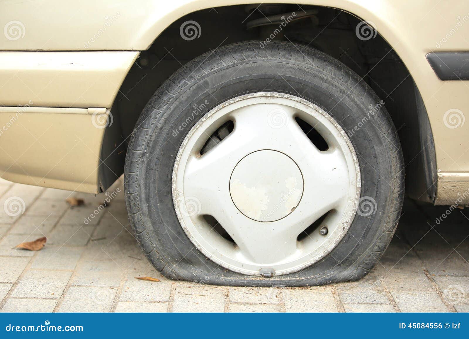 Flat tyre on car wheel stock photo. Image of automobile 45084556