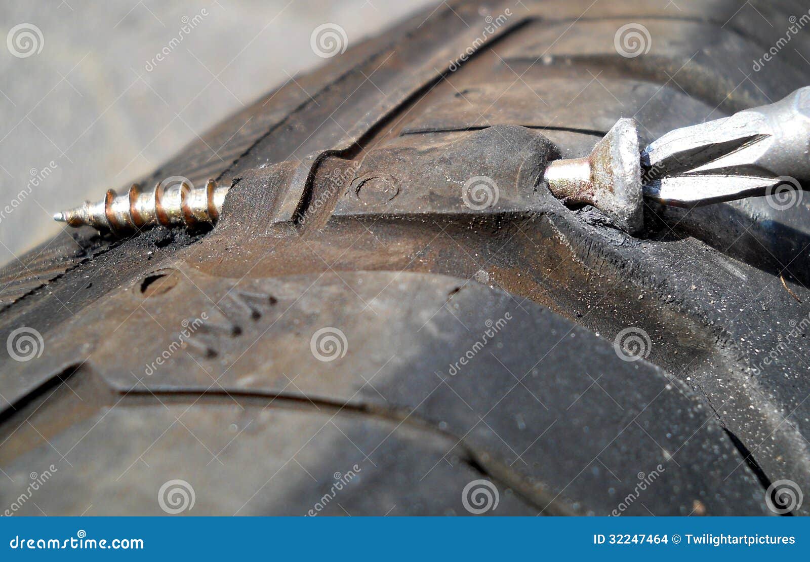 Flat tyre by screws stock photo. Image of flatly, tyre 32247464