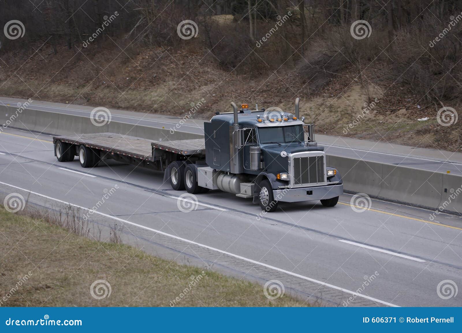 flatbed semi truck on the highway