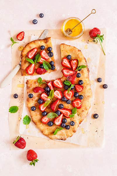Flatbread with Berries and Honey Stock Photo - Image of overhead ...