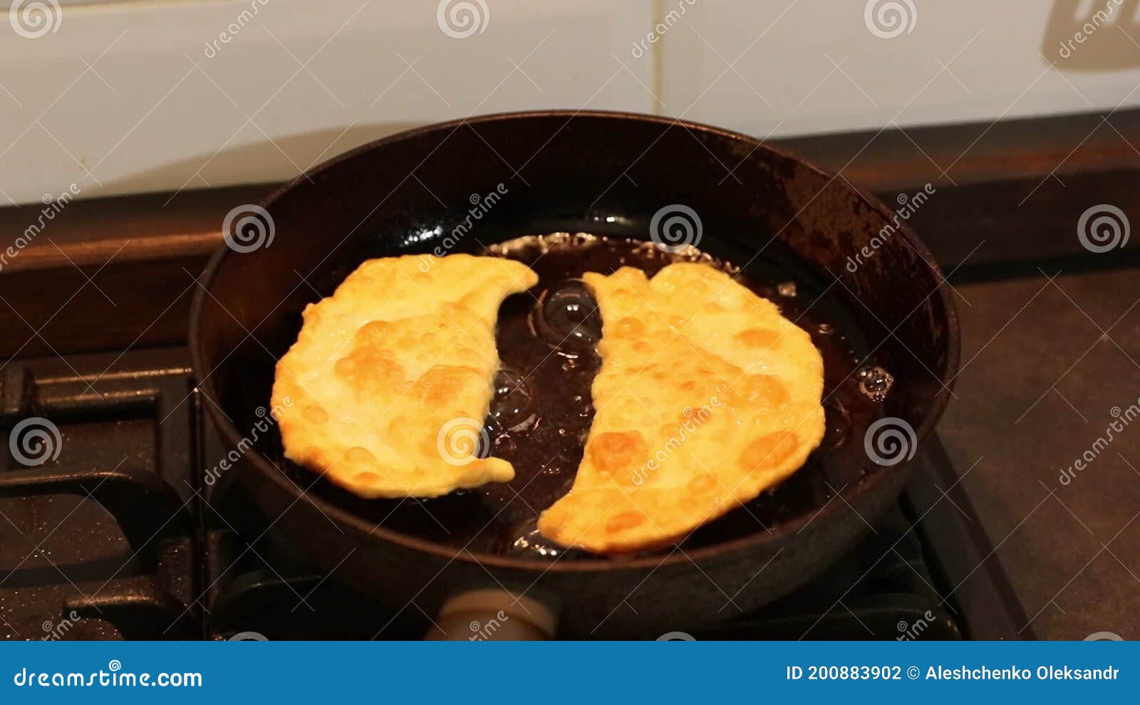 Flatbread are Fried in a Pan in Hot Oil. Stock Footage Video of food