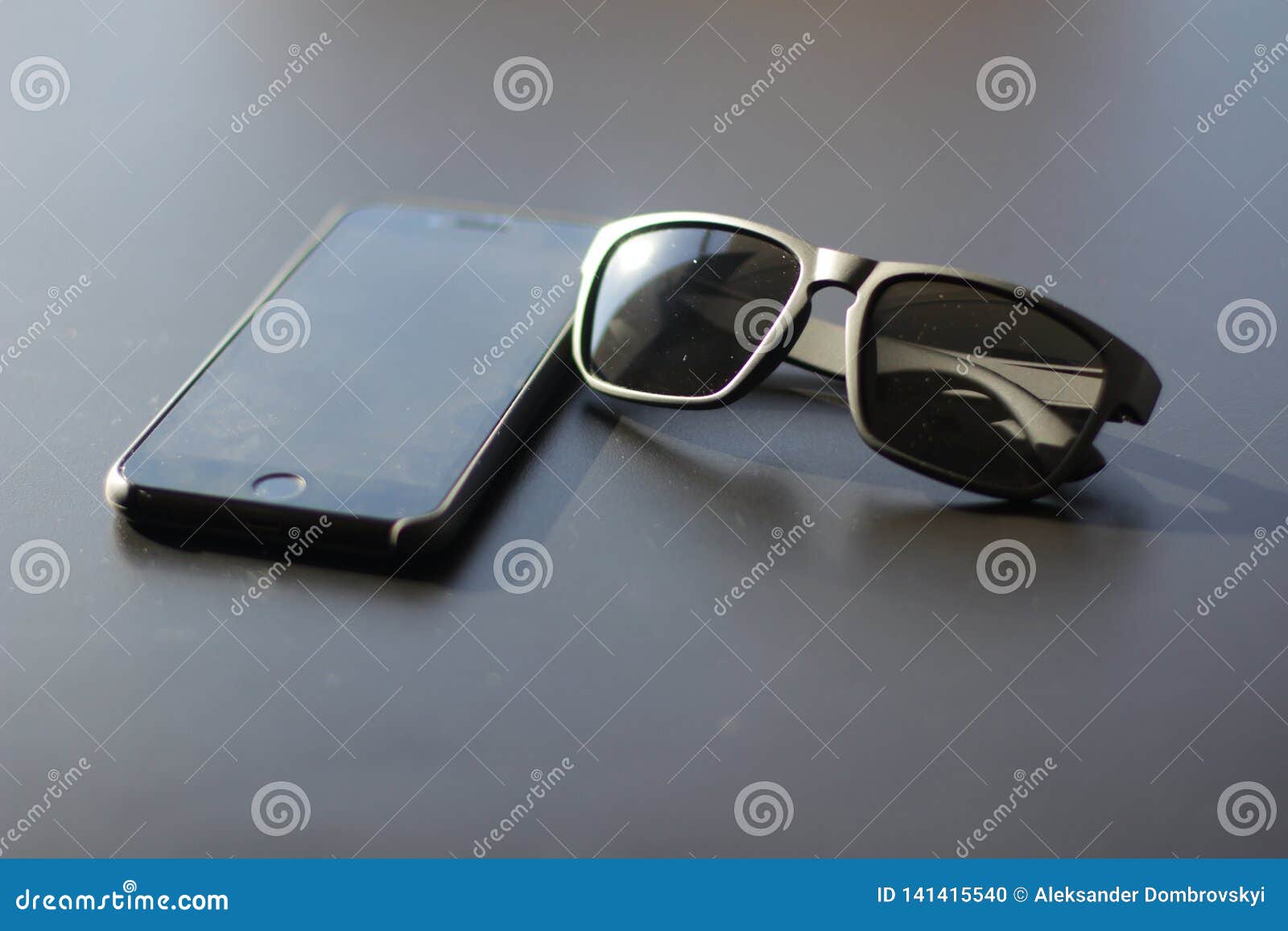 Flatlay of Black Sunglasses and Black Phone Stock Photo Image of