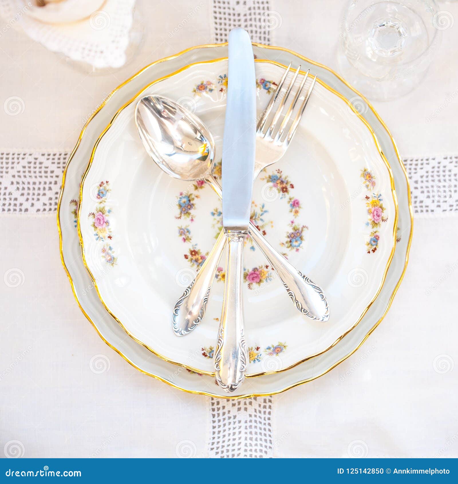 Flatlay with Porcelain Plates and Silver Cutlery with Lace Napkins on ...