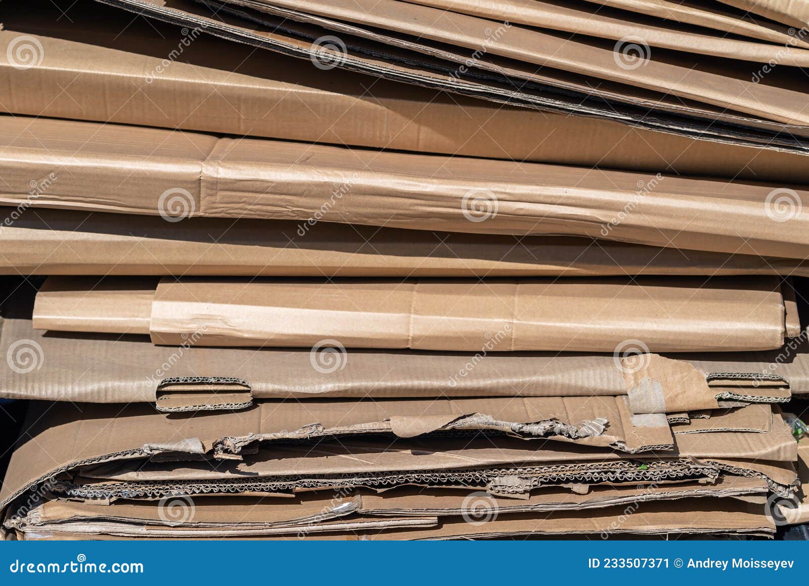 flattened cardboard boxes ready for recycling