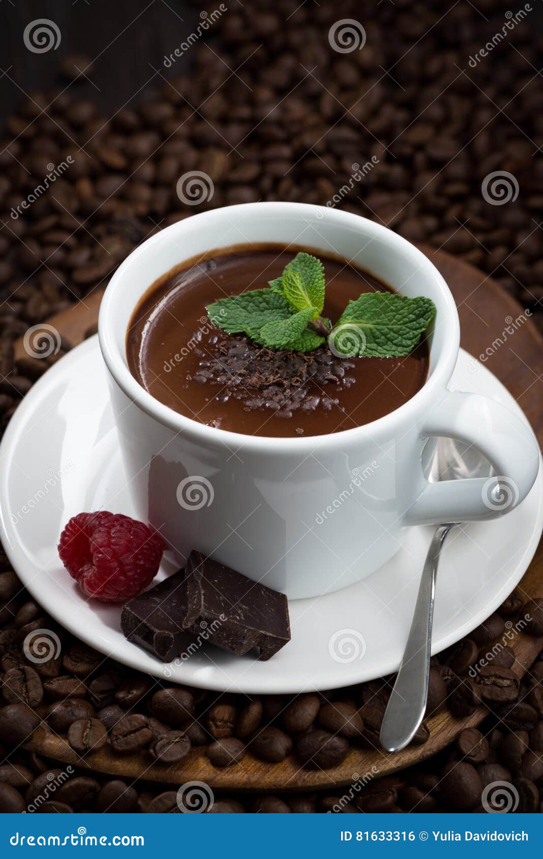 Flavored Hot Chocolate in a Cup on a Background of Coffee Beans Stock