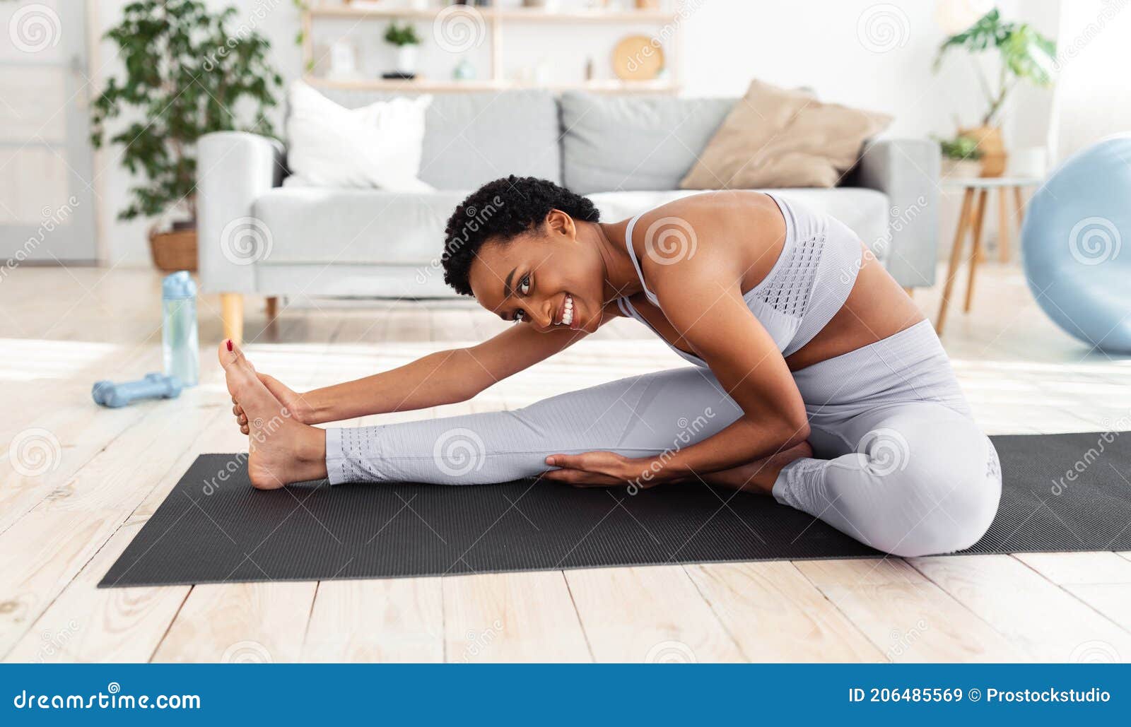 Flexibility Exercises. Athletic Young Woman Doing Yoga on Mat, Stretching  Her Legs during Home Workout Stock Image - Image of epidemic, active:  206485569