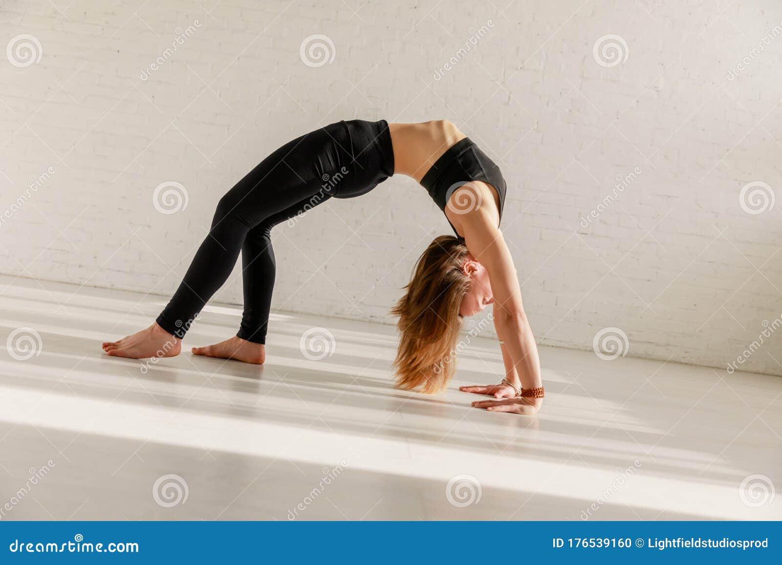 Woman in Sportswear Doing Wheel Pose Stock Photo - Image of calm ...