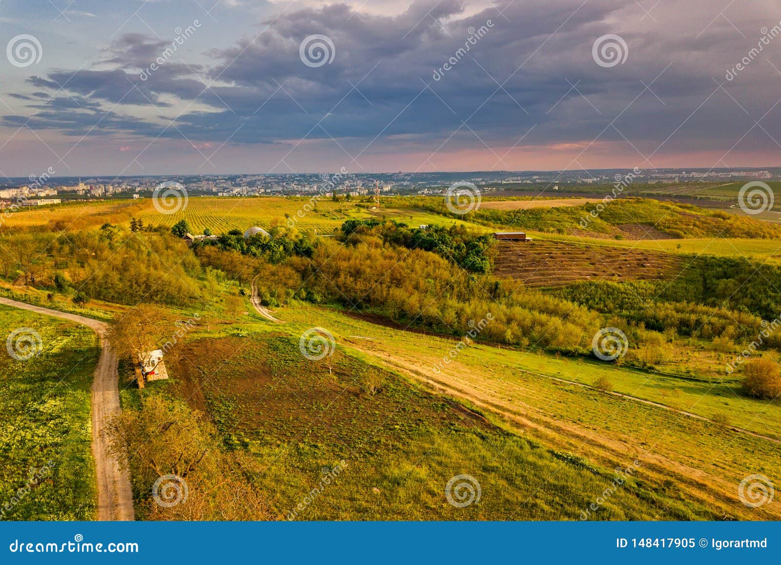 Flight Over Cultivating Field in the Spring at Sunset Stock Image