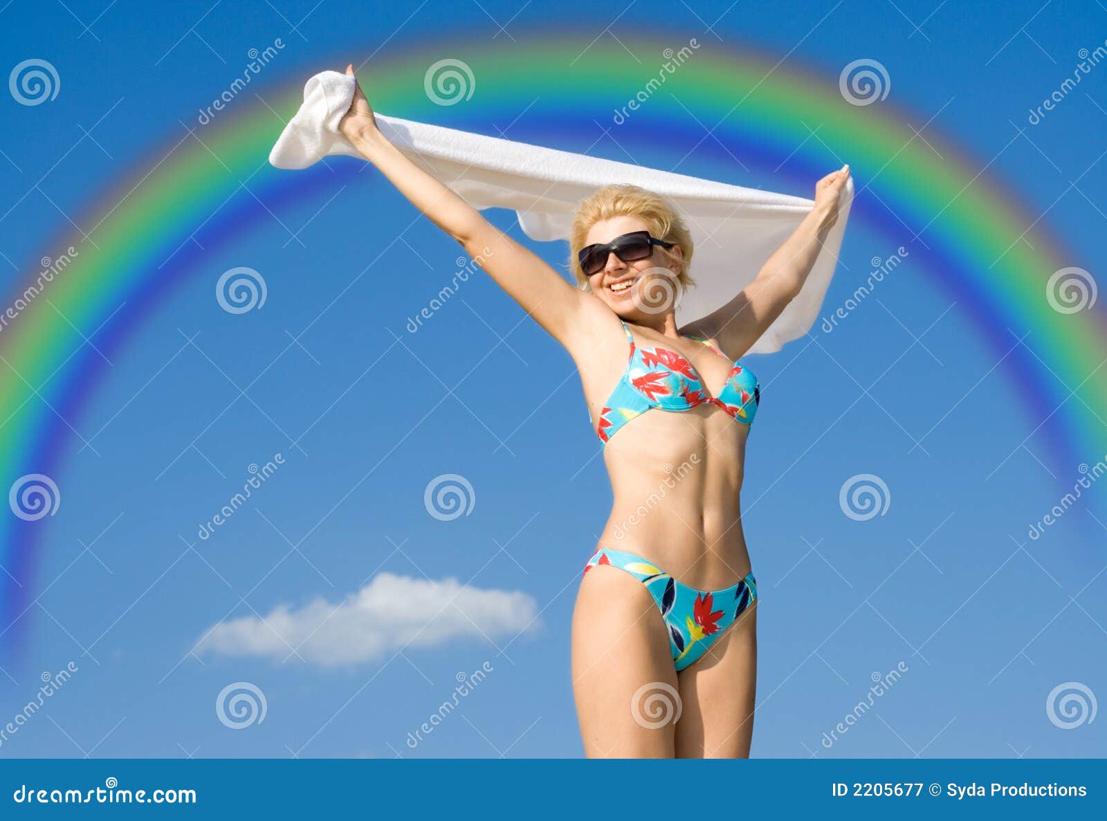 Flight over rainbow. Happy girl relaxing on the beach