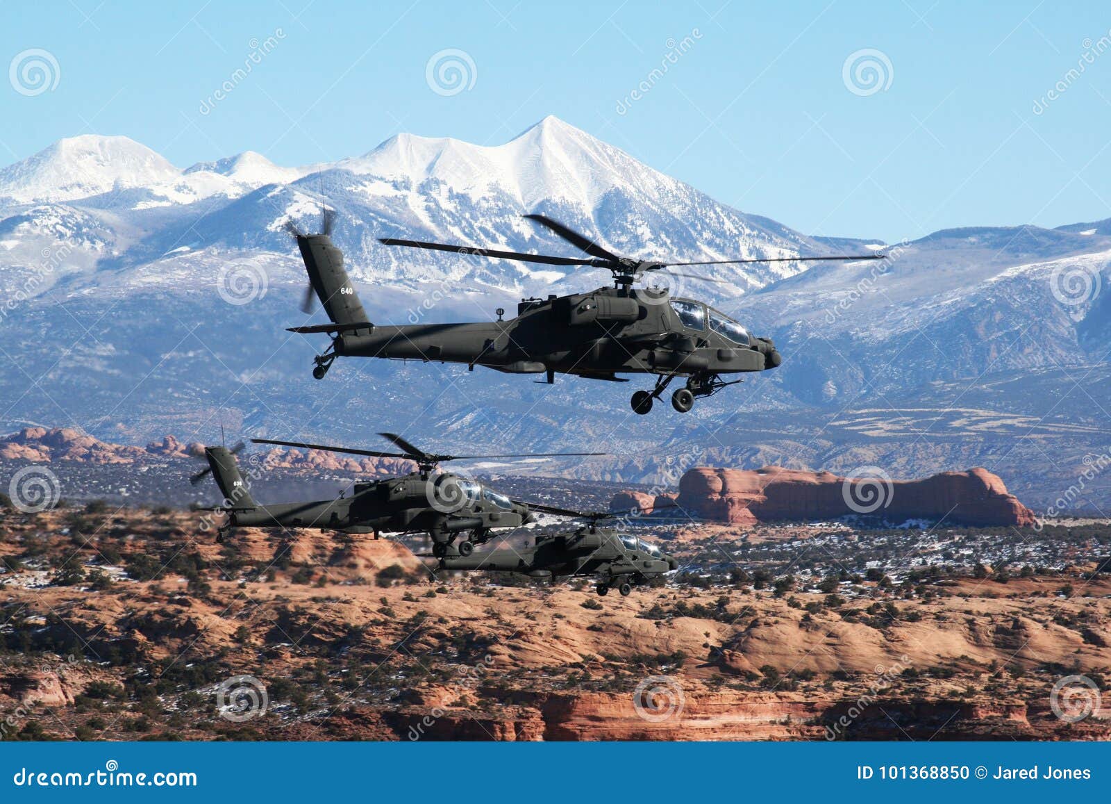 A Flight Of Three Apache Helicopters Fly Over Southern Utah Editorial