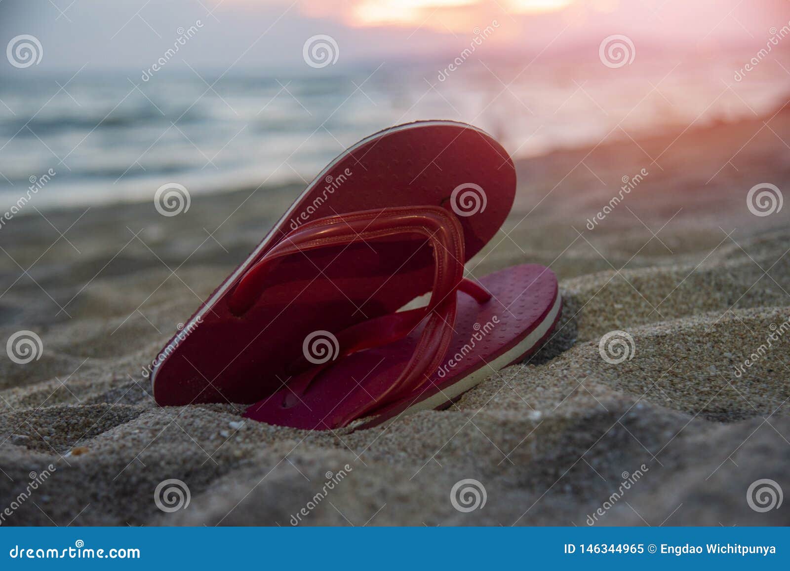Flip Flops On Beach With Sandy Beach Sunset Ocean Sea Background Stock ...