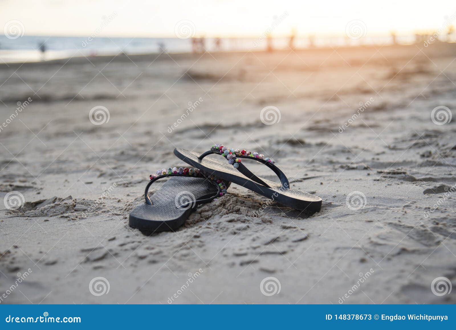 Flip Flops On Beach With Sandy Beach Sunset And Ocean Sea Stock Image ...