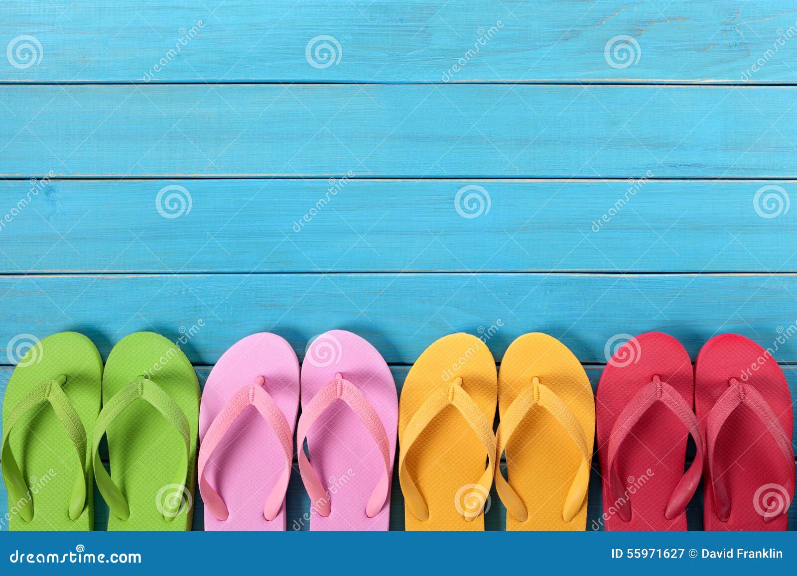 Flip Flops in a Row with Blue Beach Deck Background, Copy Space Stock ...