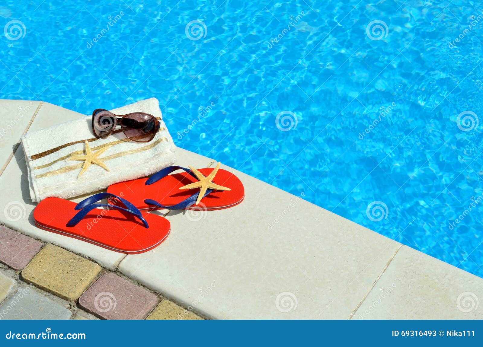 flip-flops, sunglasses, towel, starfish.
