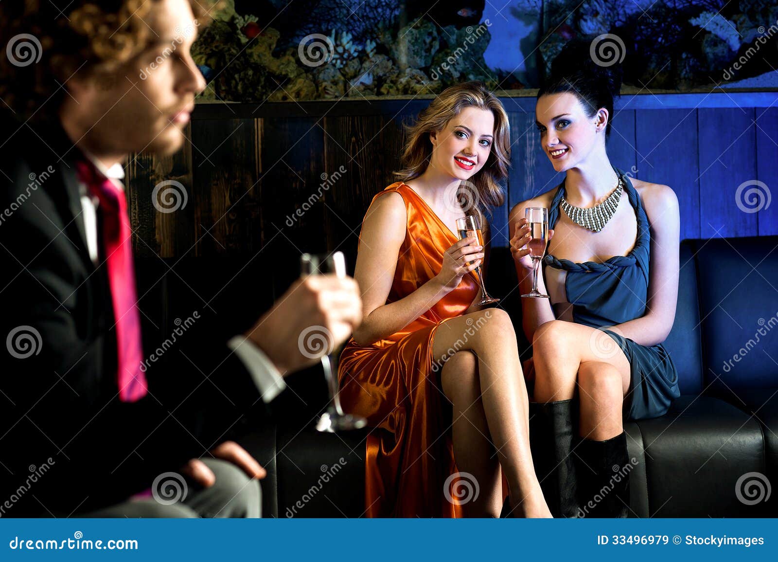 flirtatious young girls staring at handsome guy