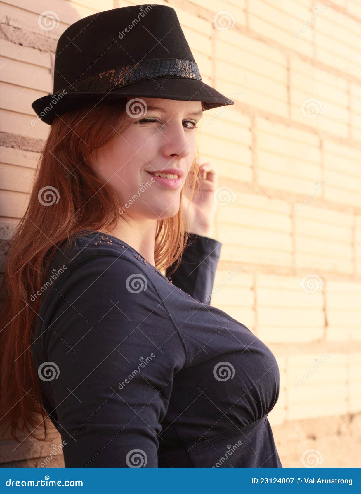A Flirty Wink stock image. Image of female, flirt, brick - 23124007
