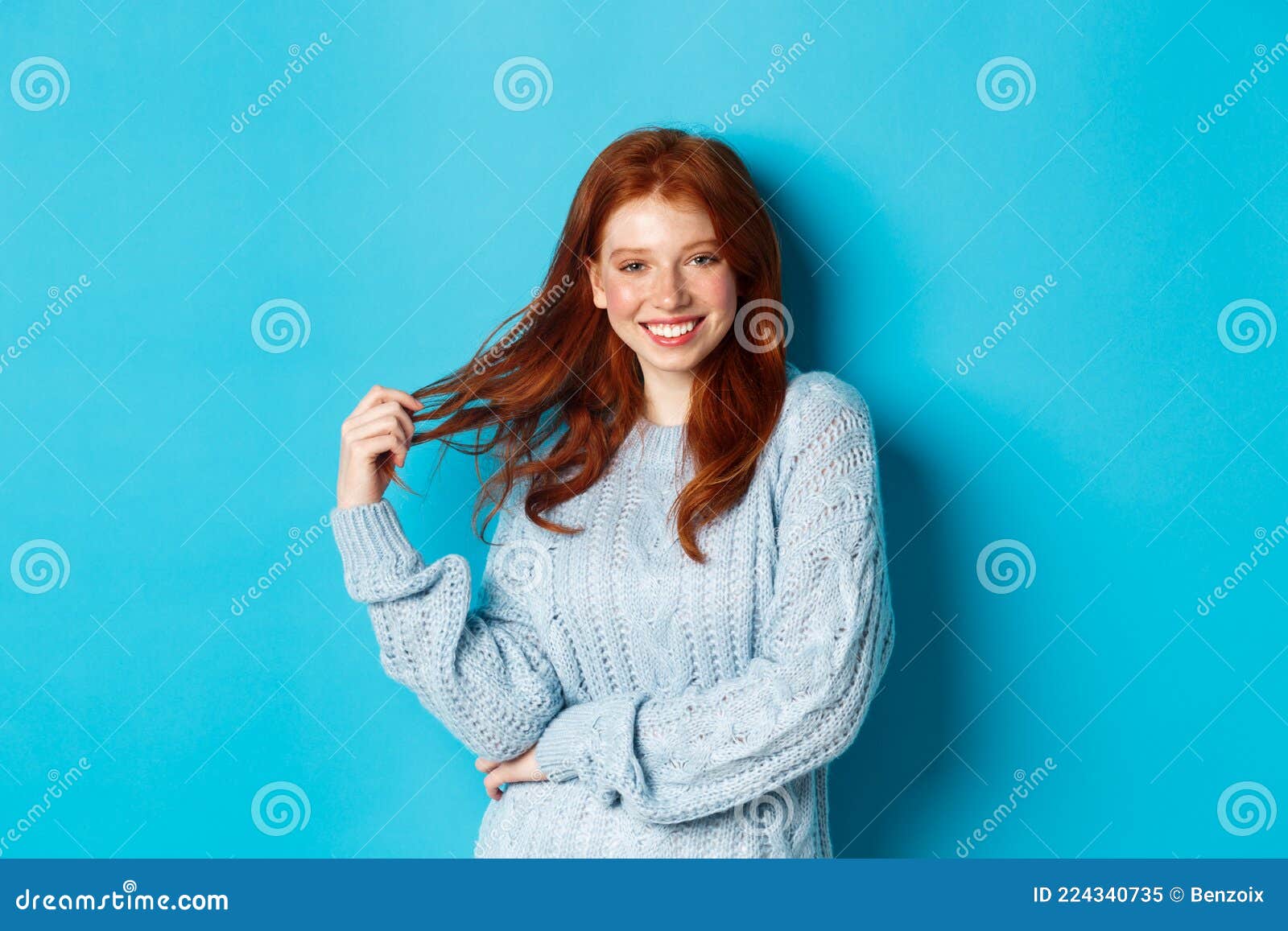 Flirty Young Woman with Red Hair, Playing with Hair and Smiling ...