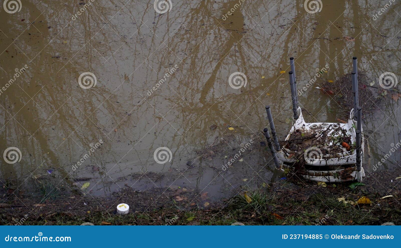 plastic chair lies in water, background image