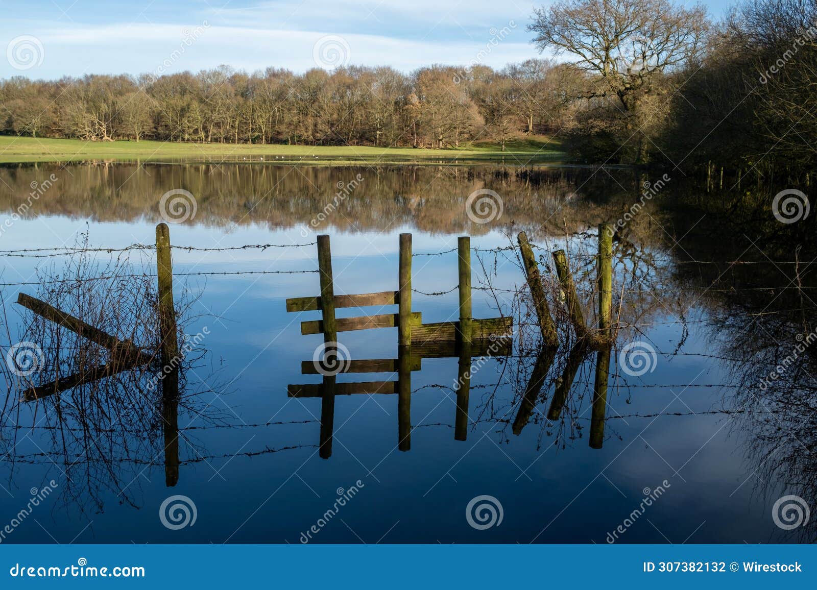 large expanse of water, flooding after heavy rain.