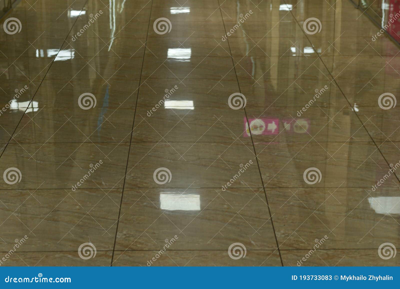 the floor on one of the floors of the modern store is paved with shiny tiles