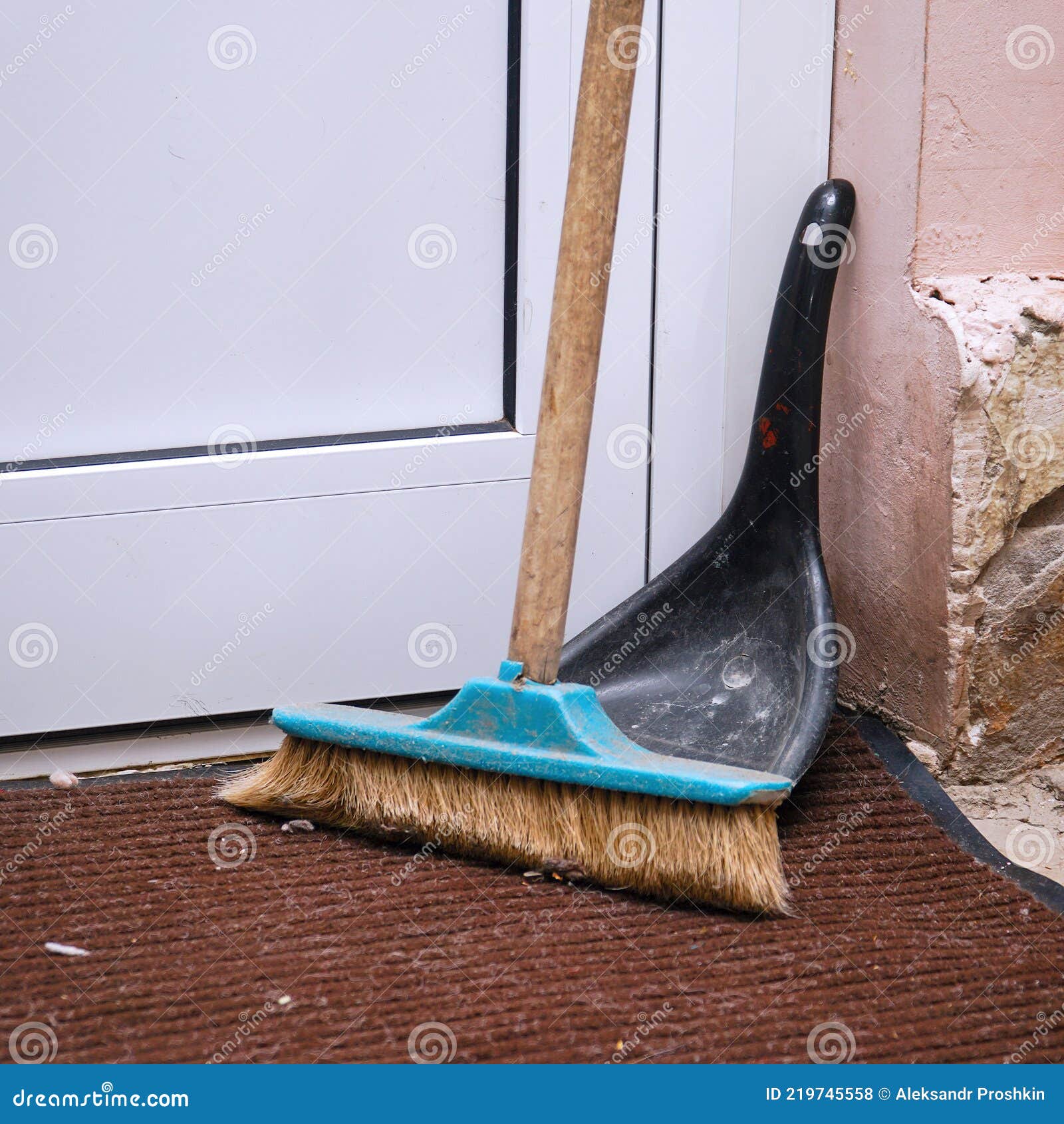 Floor-sweeping Brush and a Scoop Stand in the Corner Near the Door ...