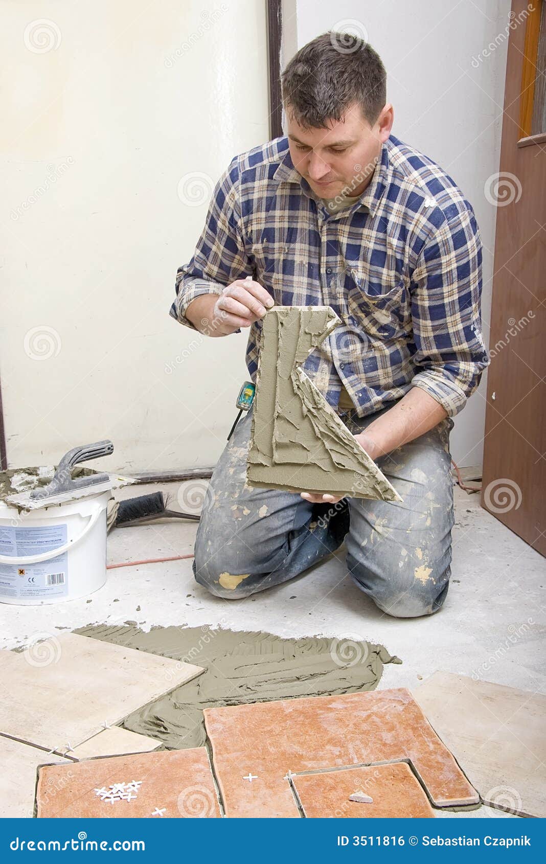 Floor tiles installation stock photo. Image of adult, arranging 3511816