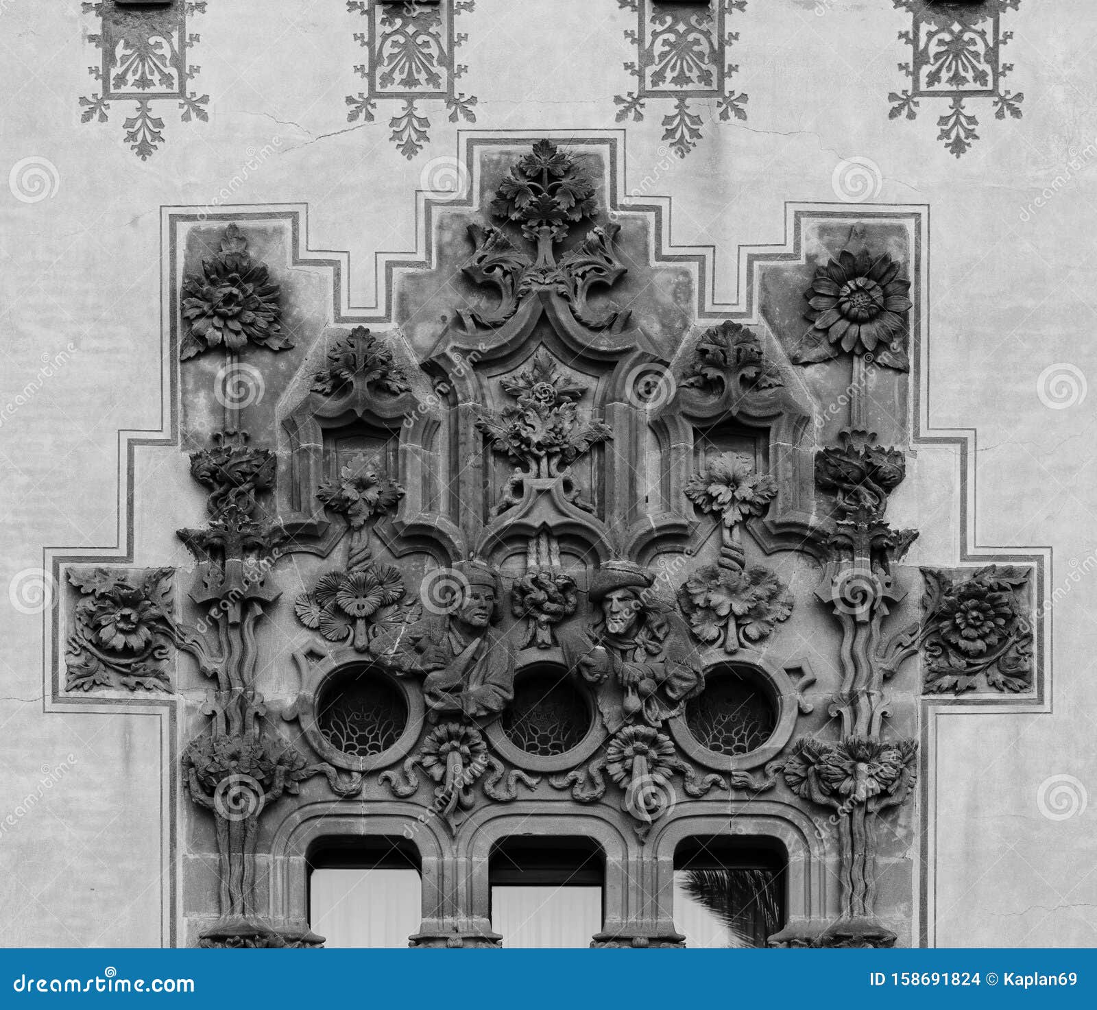 floral decoration around the window with ancient characters