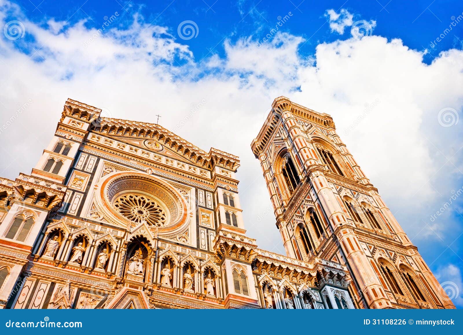 florence cathedral with giotto's campanile at sunset on piazza del duomo in florence, italy