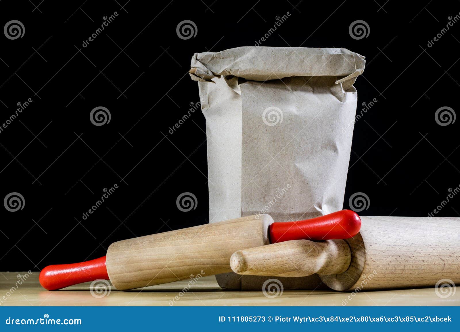 Flour and Rolling Pin for Kneading the Dough on the Kitchen Table