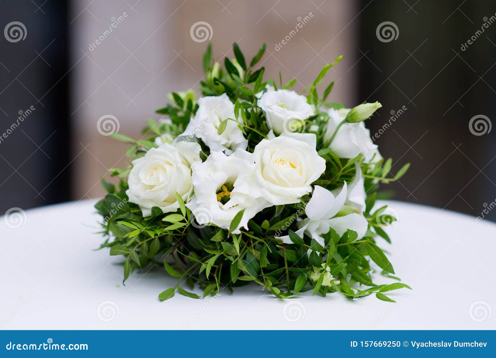 A flower bouquet of cream roses and chrysanthemums on the windows in the  church as a decoration of the holiday. Professional floristics Stock Photo  - Alamy