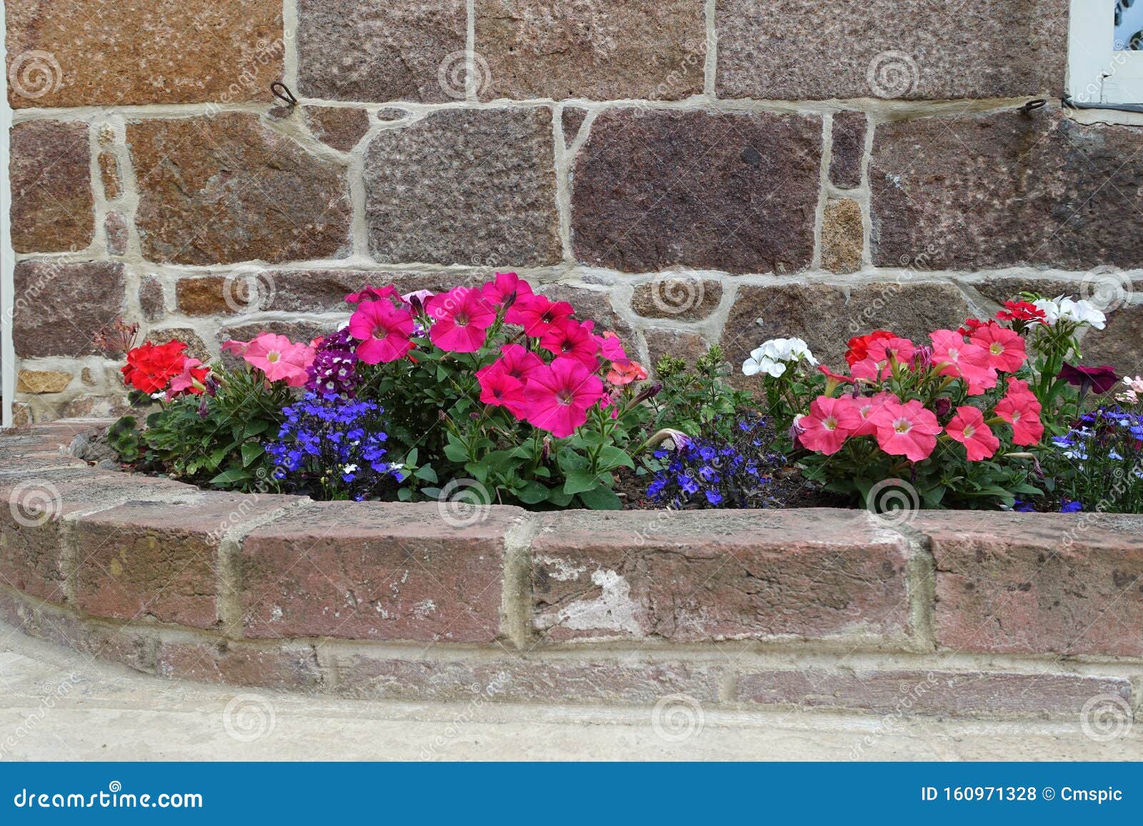 Flower Bed with Brick Surround Stock Photo - Image of surround, border ...