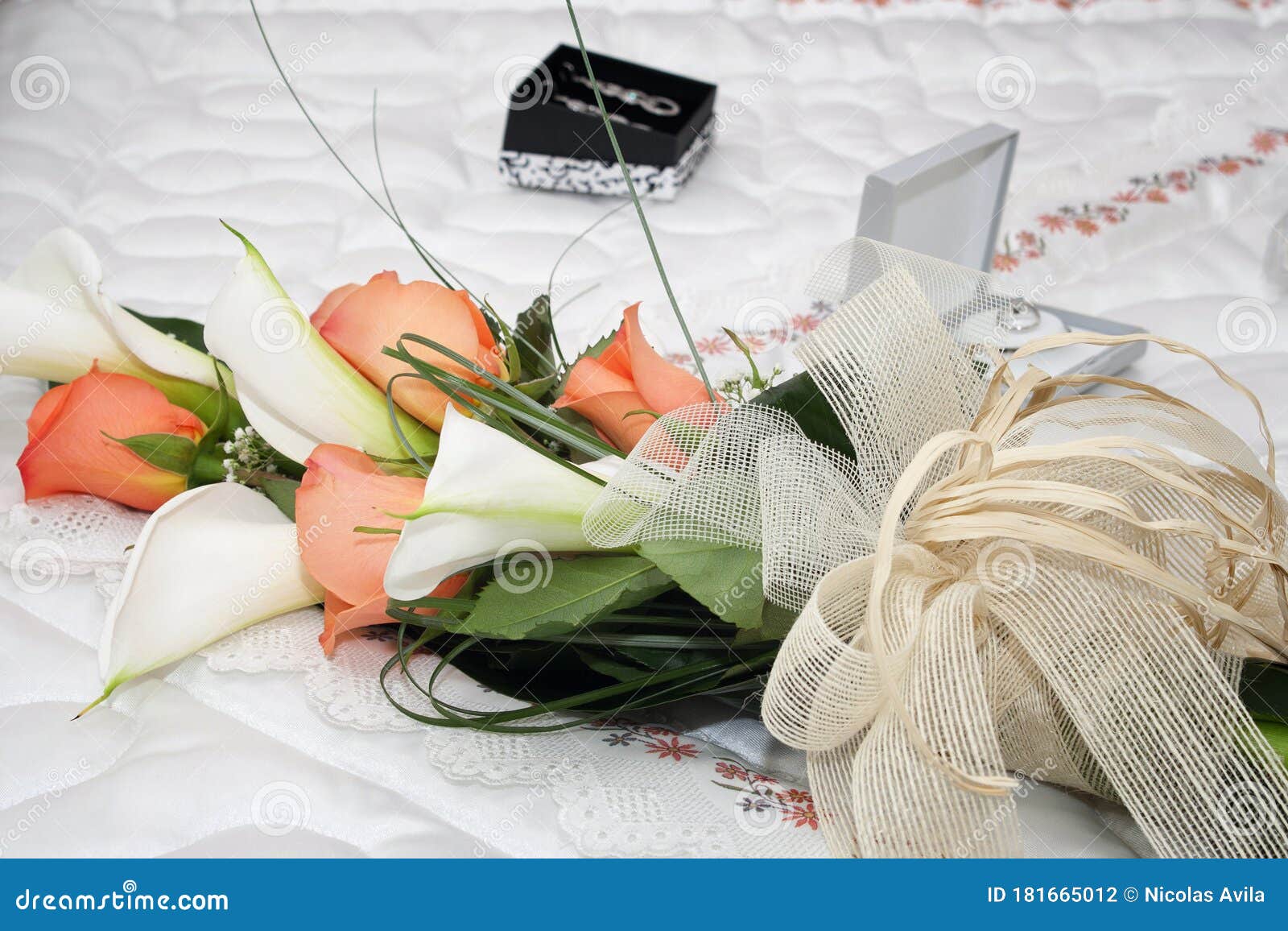 bouquet of flowers set by orange roses and white coves