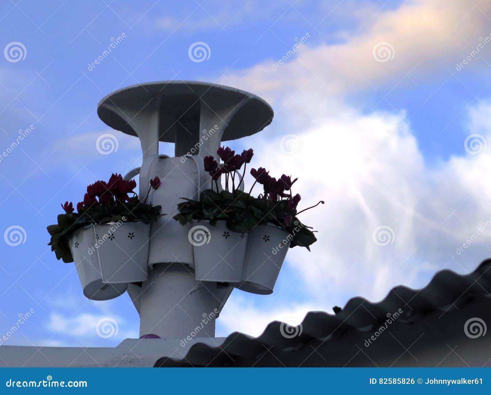 Flower pots on chimney stock photo. Image of flowers 82585826