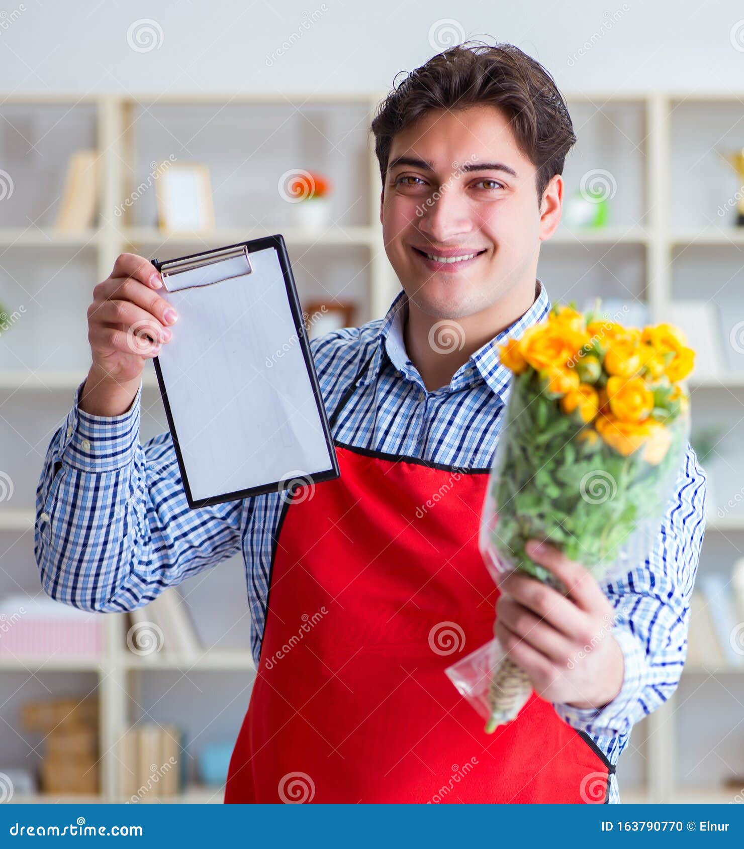 The Flower Shop Assistant Offering a Bunch of Flowers Stock Photo Image of blooming, client