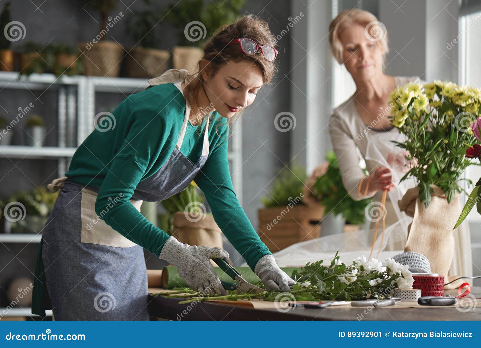 Flower shop employees stock image. Image of businesswoman 89392901