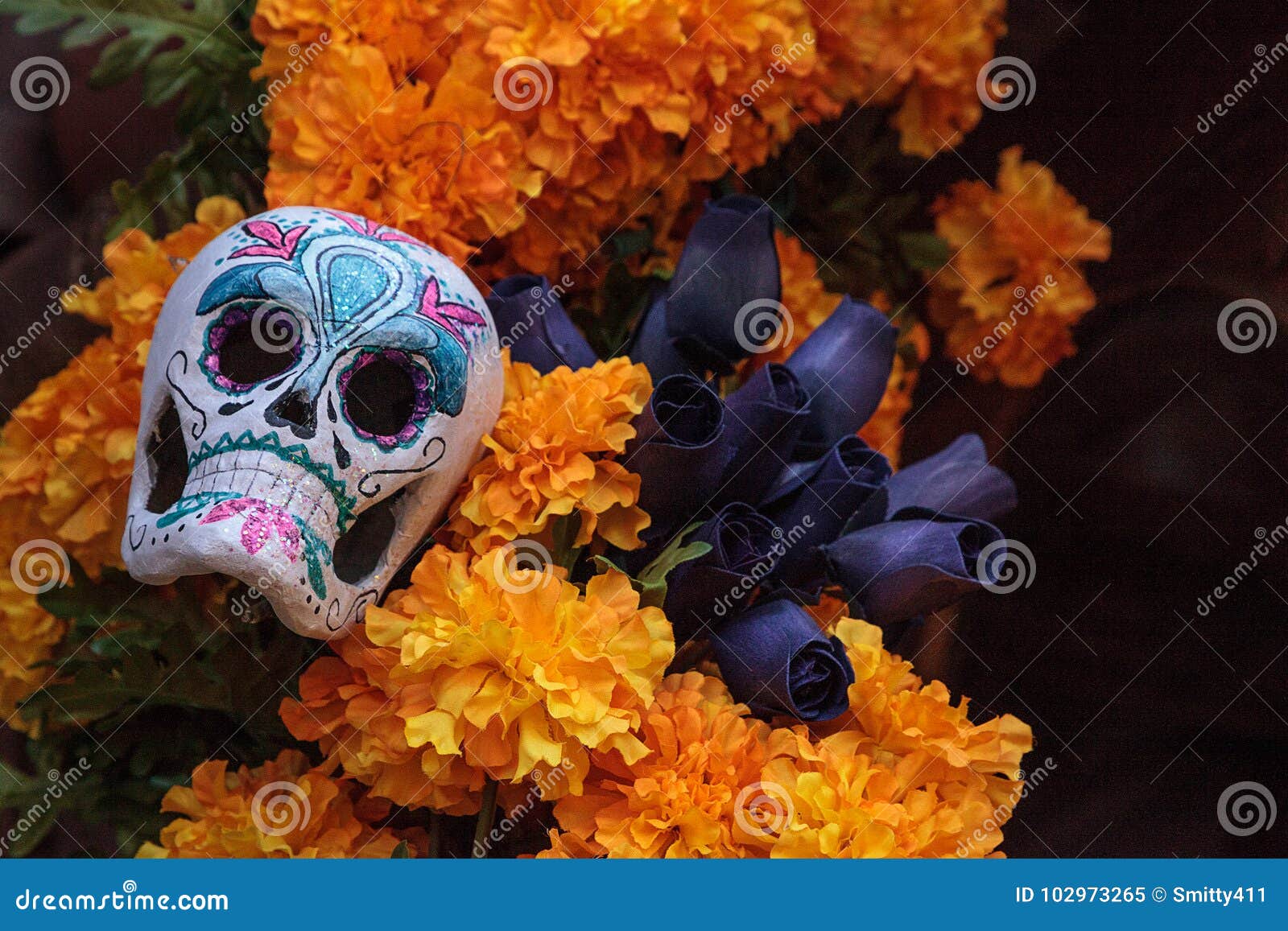 flower and skeleton alter at dia de los muertos