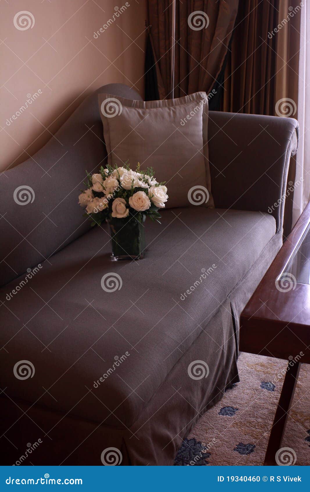 Flower vase on a sofa stock photo. Image of high, vase 19340460