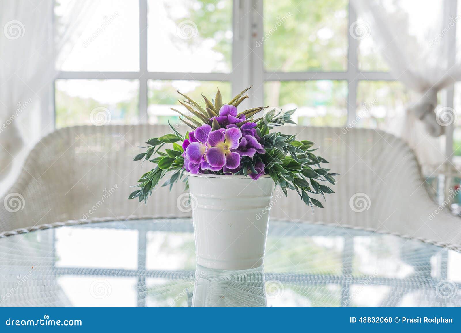 flower in vase on table and window sill background. vintage style decorate