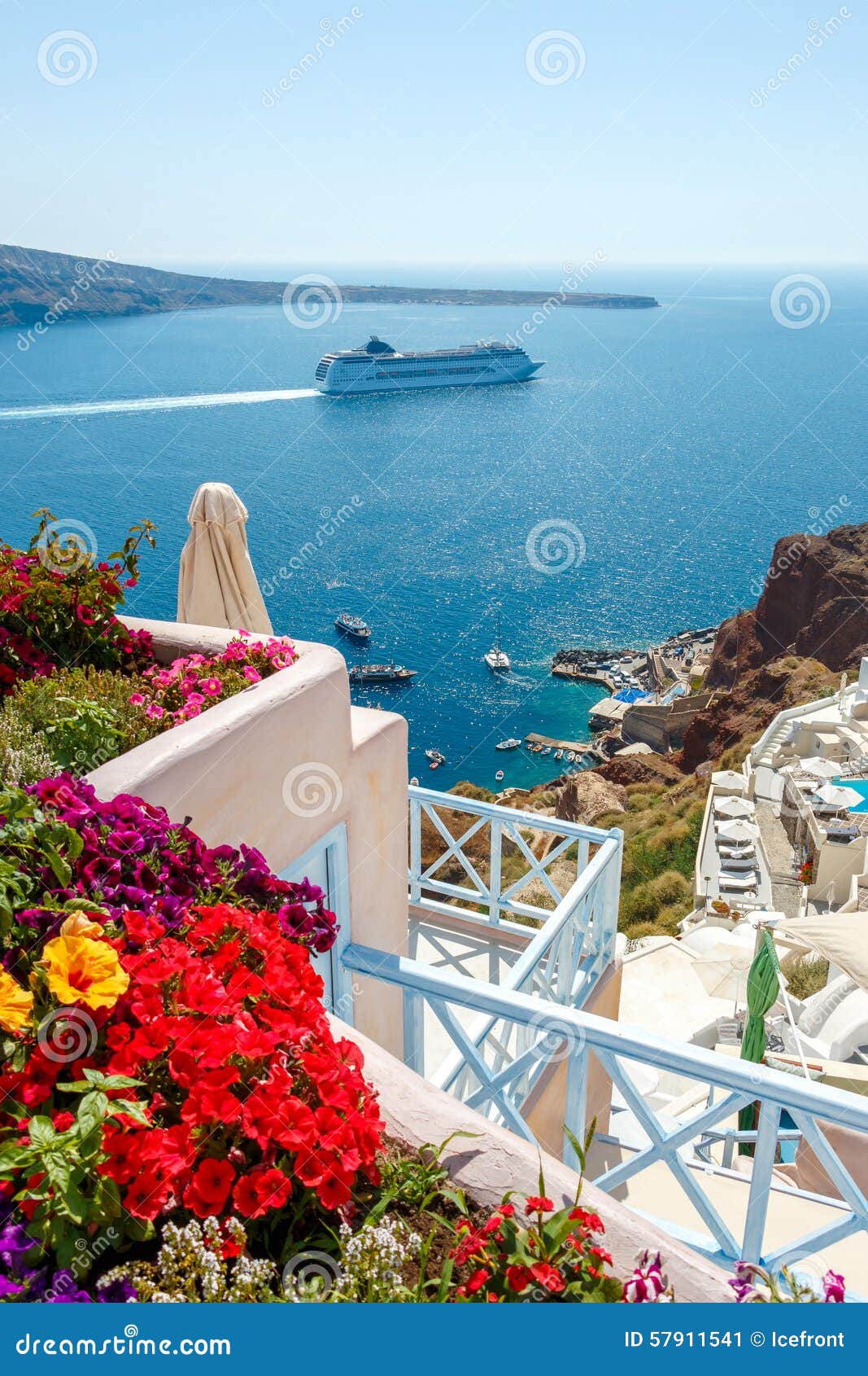 flowers, buildings and cruise ship in oia, santorini