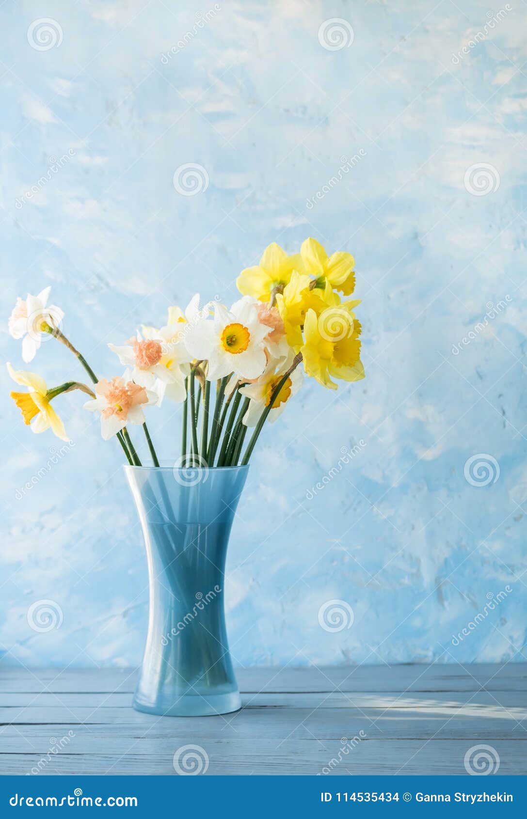 Flowers of Daffodils of Different Kinds in a Blue Vase Stock Photo ...