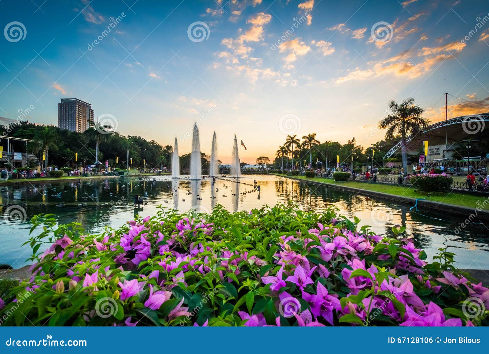 flowers and fountains at sunset at rizal park, in ermita, manila