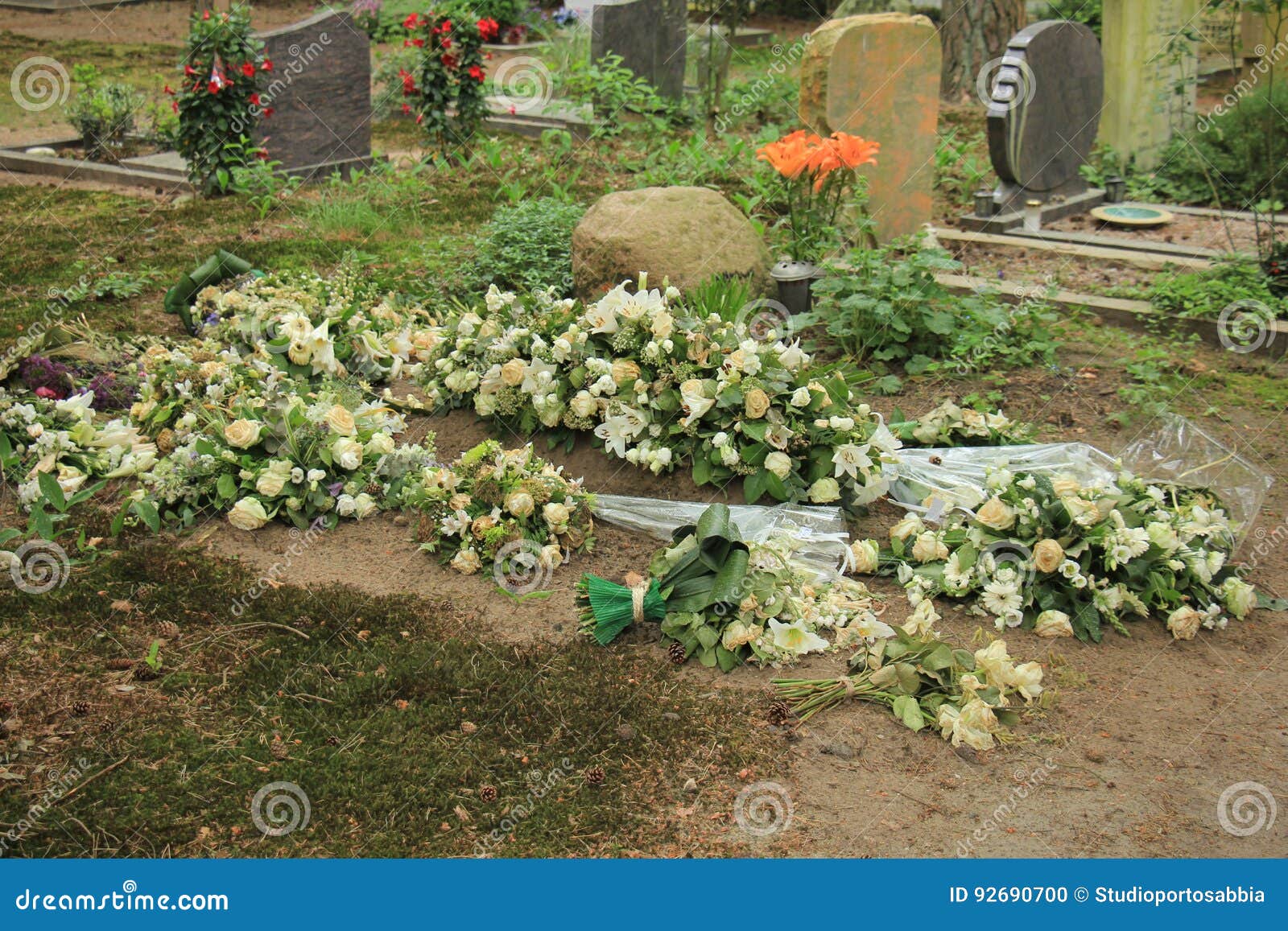 Flowers on a grave stock photo. Image of wreath, burial 92690700
