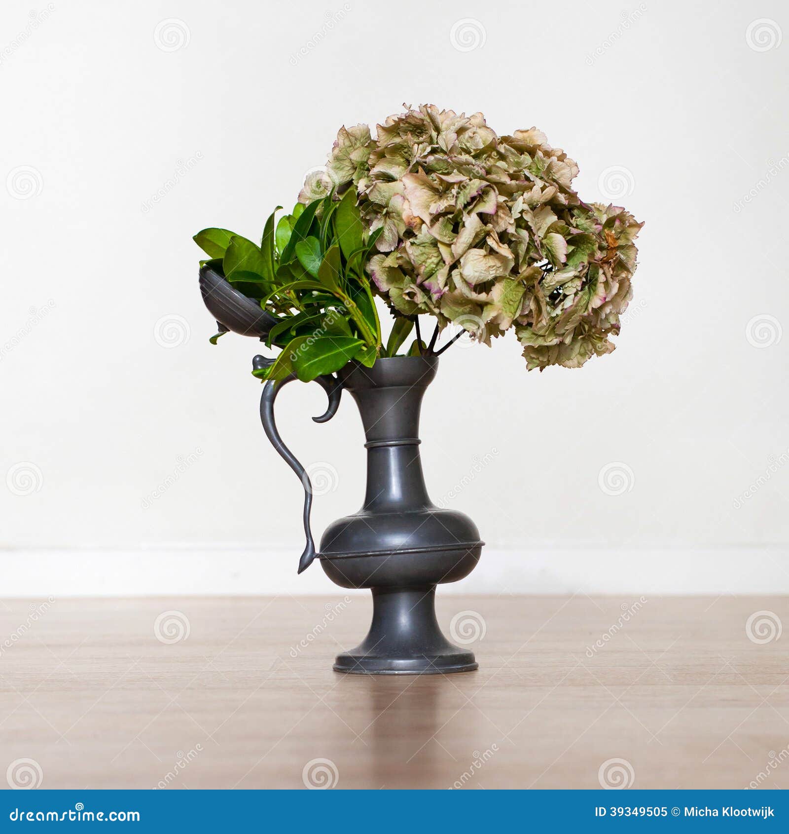 Flowers in an old tin vase stock image. Image of rack 39349505