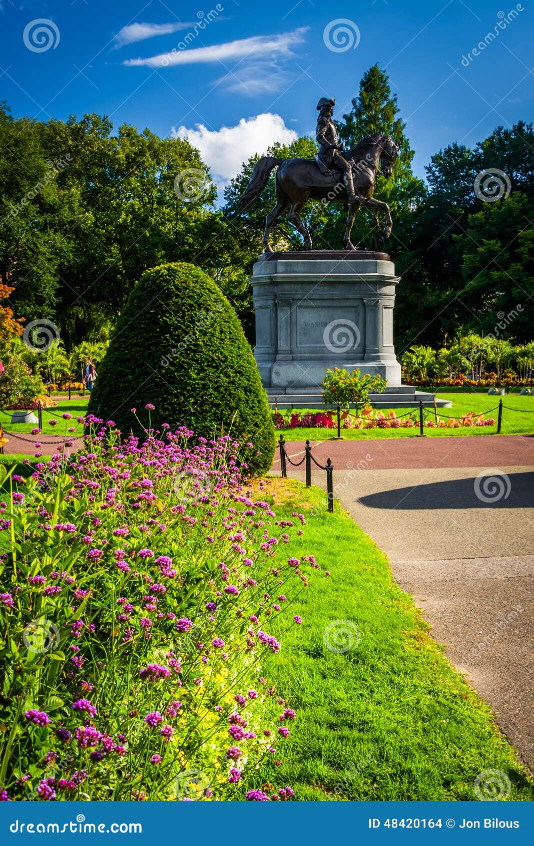 flowers and statue of george washington at the commons in boston