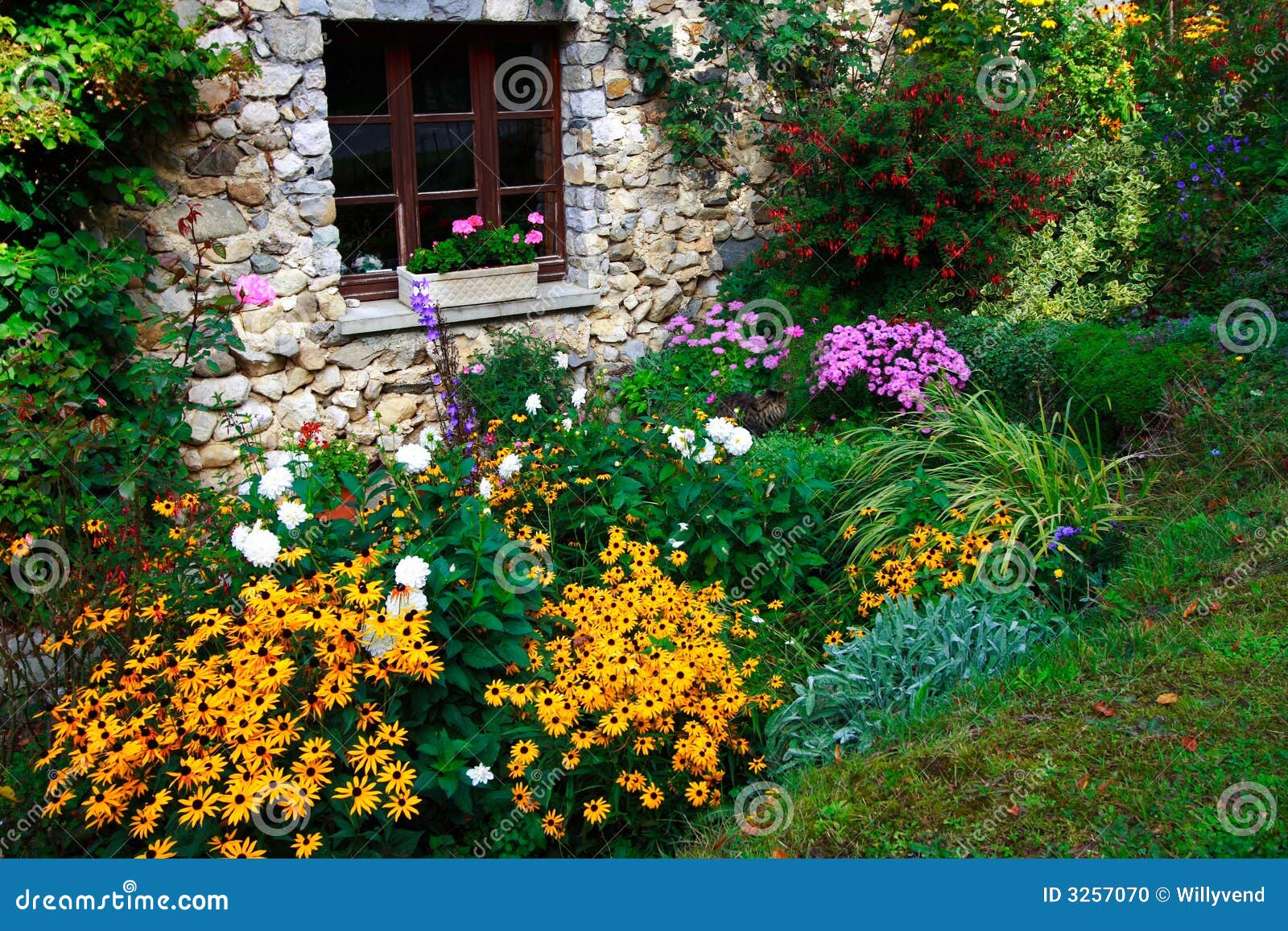 flowers and stone-built house