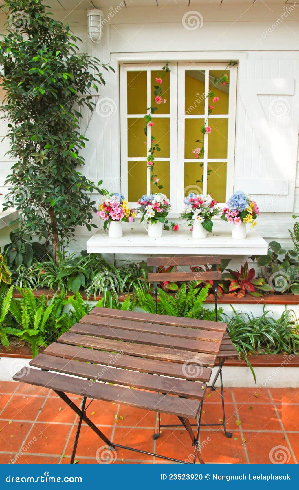 Flowers with Table and Chair in Garden Stock Photo Image of